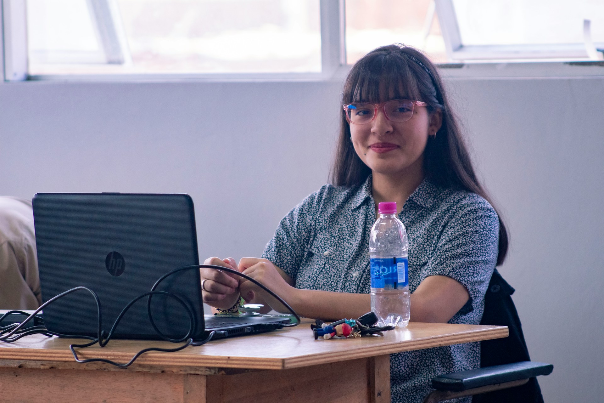 Student researching different TEFL courses on a laptop