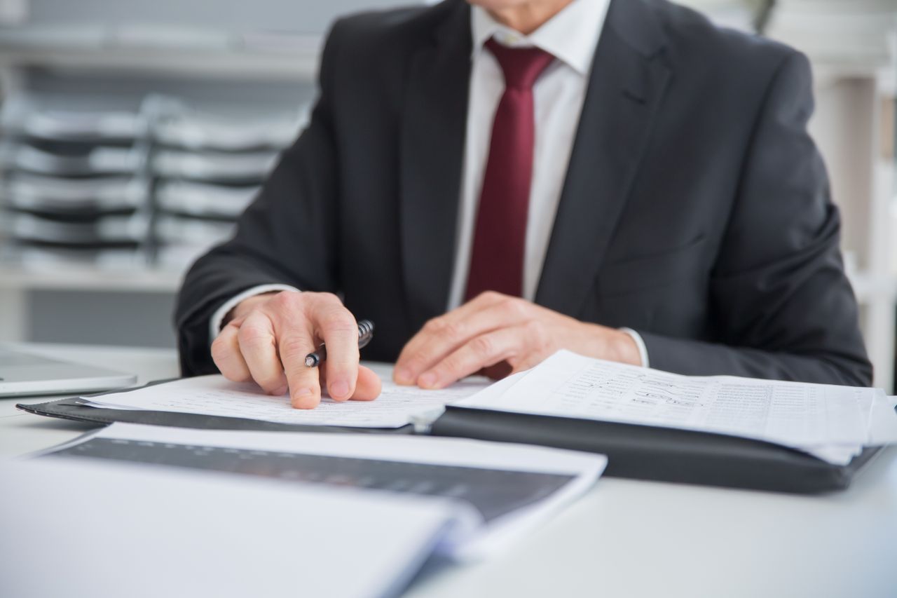 Professional managing digital business documents on a computer
